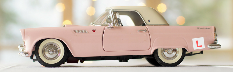 Pink vintage car with L-plate